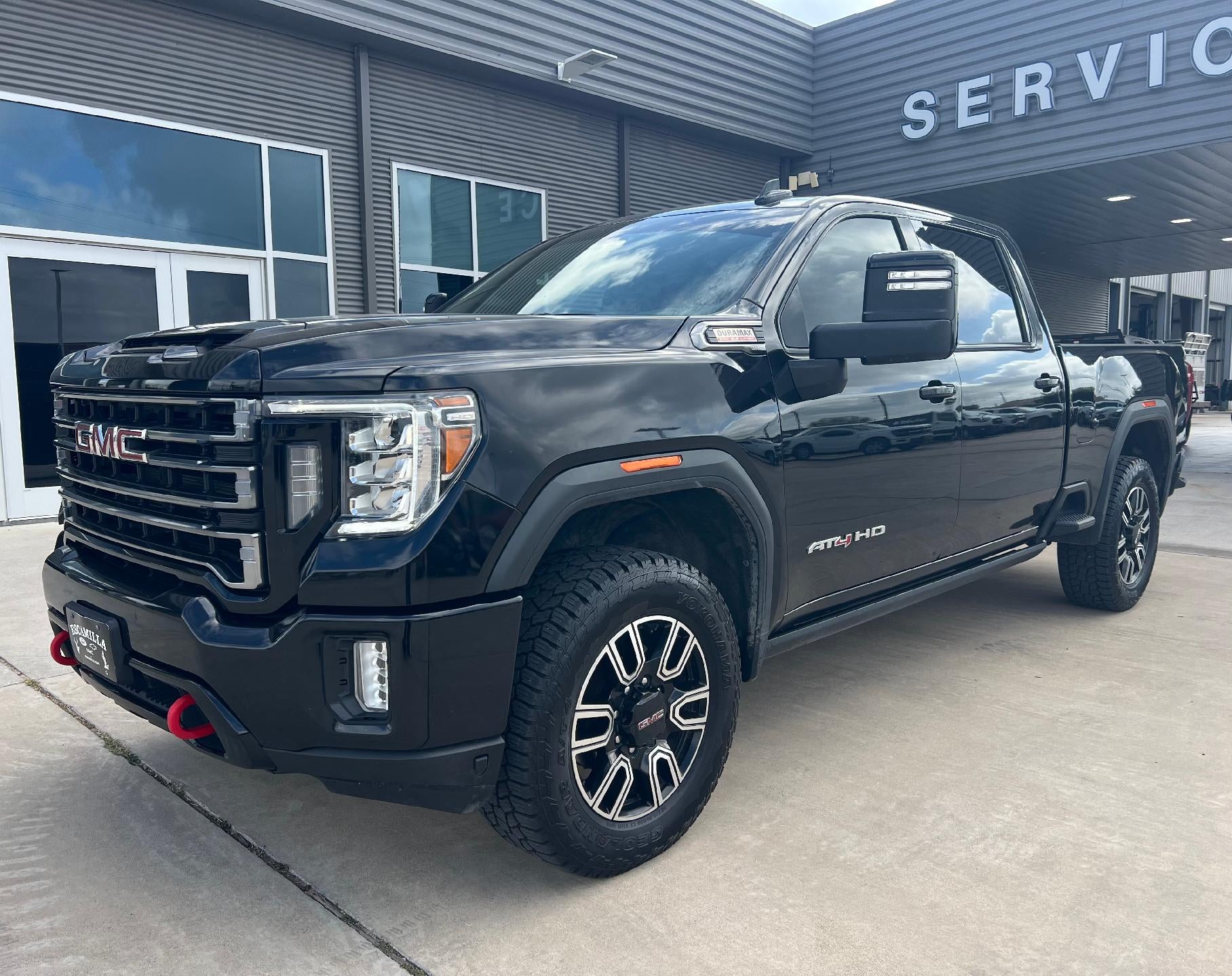 2023 GMC Sierra 2500 HD AT4 in Ebony Twilight Metallic — front three-quarter view